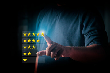 Man touch futuristic virtual screen with satisfaction survey, Showing the number of gold stars ...