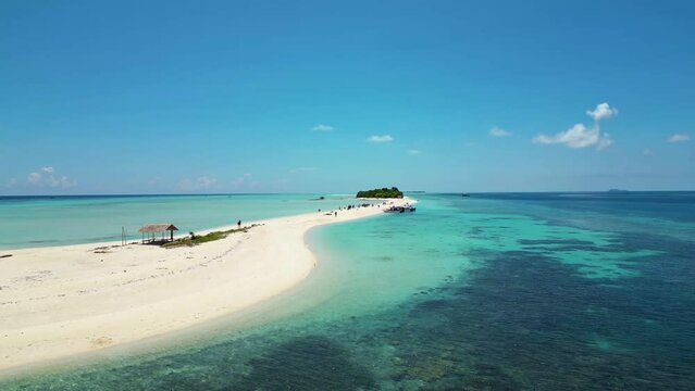 bounty island in Malaysia, low flying aerial, azure blue sea, sunny white sand beach