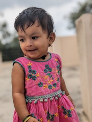 First Step of a Baby girl portrait in Pink dress