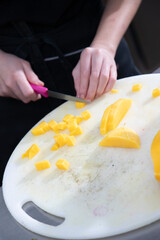 Baking of petite gateau in dessert kitchen. Bright kitchen environment. Pastry chef making finely crafted dessert. Human hand at work.