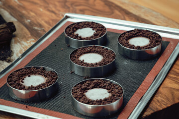 Chocolate dough on baking tray. 