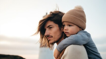 Tender Moment Between Father and Child Outdoors at sea