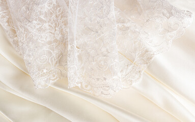 Part of the delicate bridal tulle of the bride and delicate pleats of satin in cream, beige,...