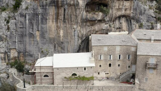 Blaca Hermitage Memorial On Rock Mountains In Brac Island, Split-Dalmatia County of Croatia. Aerial Sideways Shot