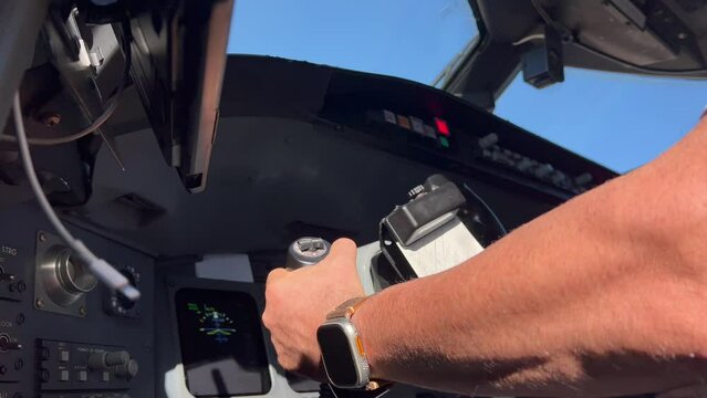 In flight emergency simulation, left engine fire, in a modern jet cabin. Close up view, Captain side, low angle.