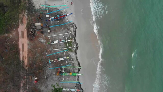 Traditional fishing boats on Serdang beach at Indonesia, aerial