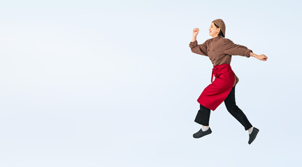 Fototapeta na wymiar ジャンプする調理服を着た女性　調理師　飲食店店員　切り抜き全身写真（切り抜き背景透過PNGも販売しております。作成者リンクから「PNG」で検索してください）