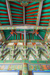 Closed up of intricate detail colourful painted patterns in Wooden Korean Temple 