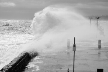Giant Waves Crashing Over Mornington Jetty. Mornington Pier is a popular destination for a range of recreational activities including sightseeing, fishing and scuba diving.