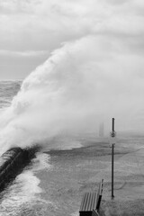 Giant Waves Crashing Over Mornington Jetty. Mornington Pier is a popular destination for a range of recreational activities including sightseeing, fishing and scuba diving.