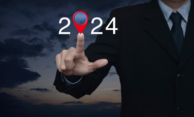 Businessman pressing 2024 letter with map pin location icon over sunset sky, Happy new year 2024 map pointer navigation concept