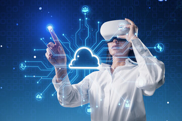 Attractive young european businesswoman with VR glasses using creative digital circuit cloud on blue background. Data storage, server and technology concept.