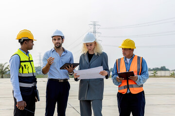 Electrical Engineer Technician meeting clean and green alternative energy concept. Architectural engineering working with solar energy equipment on construction sites, meeting, clean energy