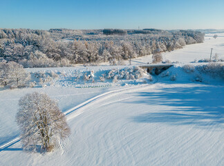 Aerial view of a snow-covered winter wonderland in southern Bavaria, Germany 