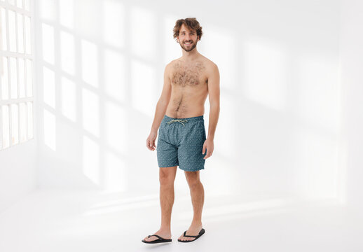 Mockup of man wearing customizable patterned shorts and no top
