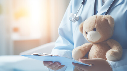 a close-up shot of a doctor holding a teddy bear, symbolizing innocence and vulnerability - obrazy, fototapety, plakaty