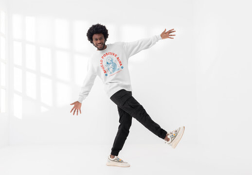 Mockup of man wearing customizable sweatshirt on one leg, smiling