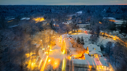 Winter Forest speed Aerial with lights , houses in Sachsenwald germany  - obrazy, fototapety, plakaty