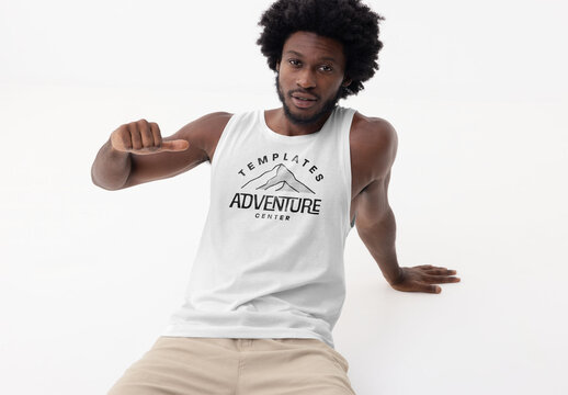 Mockup of man wearing customizable vest in studio, arm raised