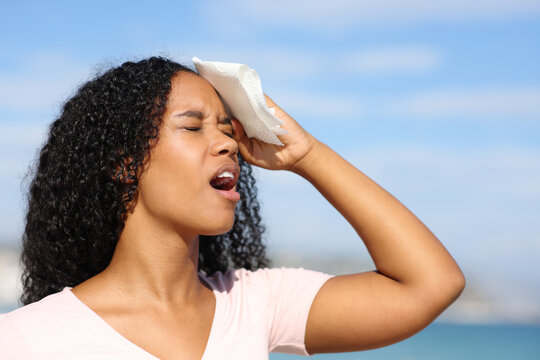 Overwhelmed black woman sweating a hot day