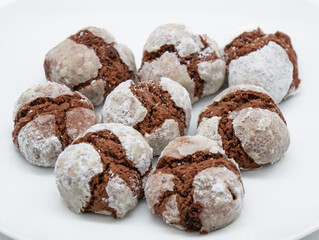 Cracked chocolate cookies with layer of whit sugar on the topa