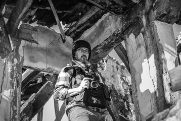 Photojournalist documenting war conflict. in the mountains. concept of war, military, technology...