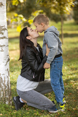 Portrait of a beautiful mother with her son outdoors