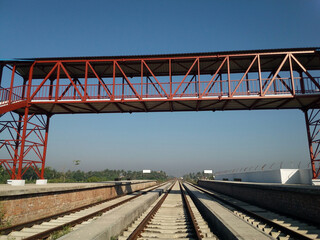 Fototapeta na wymiar Metallic footover bridge at railway station