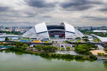 Aerial view of the Singapore National Stadium located next to the Kallang Basin and reservoir - obrazy, fototapety, plakaty