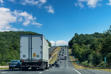 Drivers perspective view over busy and hilly Interstate 84 highway in northerly direction near...