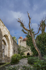 Internal courtyard of Saint John of the Hermits church, city of Palermo IT - 687879054