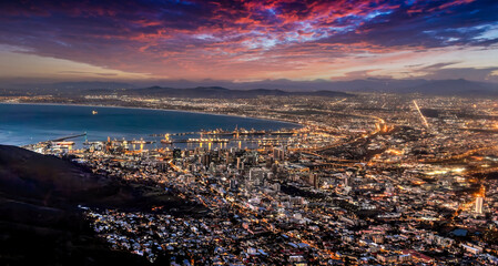 Fototapeta premium aerial view night Cape town, waterfront and the ocean, city lights are on