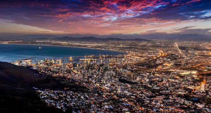 aerial view night Cape town, waterfront and the ocean, city lights are on