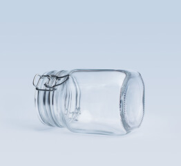 Empty clip-top glass jar lying on a side