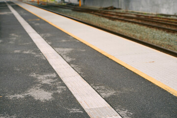 A Pedestrian Area for Blind People at a Train Station. A Yellow Tactile Floor and Signs to Help with Navigation and Accessibility.