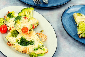 Omelette or omelet with vegetables and shrimp.