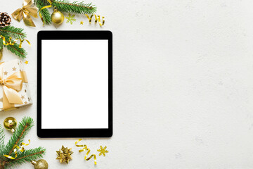 Digital tablet mock up with rustic Christmas decorations for app presentation top view with empty...