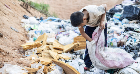Poor children on the garbage dump and selecting plastic waste to sell, children not in school,...