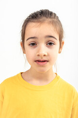 Fototapeta premium Portrait of girl in yellow t-shirt, isolated on white background.