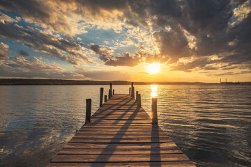 Fototapeta na wymiar Small Dock and sunset at the lake