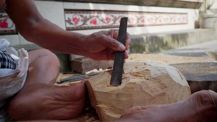 Traditional mask making process in Bali. Watch closely, during the process master holds wooden figure with his own feet. A very sacral techniques which pass through generations from fathers to sons.