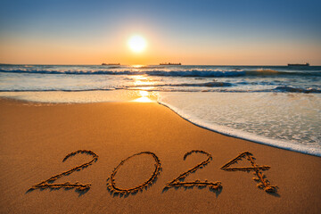 Happy New Year 2024 concept, lettering on the beach. Sea sunrise - obrazy, fototapety, plakaty