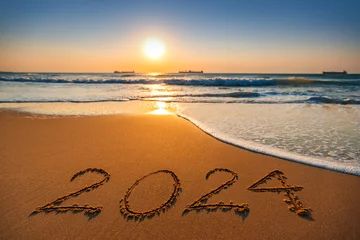 Deurstickers Happy New Year 2024 concept, lettering on the beach. Sea sunrise © ValentinValkov