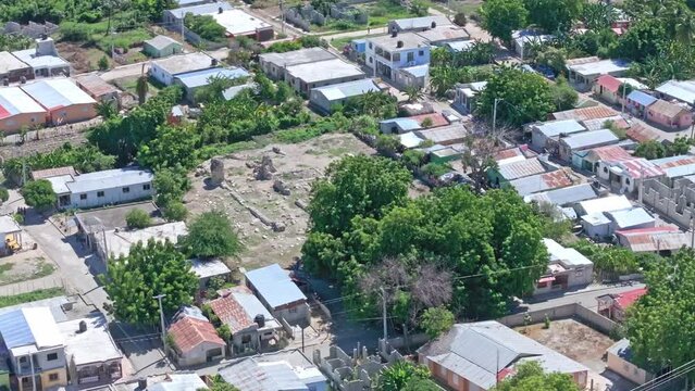 La Merced Convent Ruins Surrounded By Residential Houses In Pueblo Viejo, Azua, Dominican Republic. - aerial shot