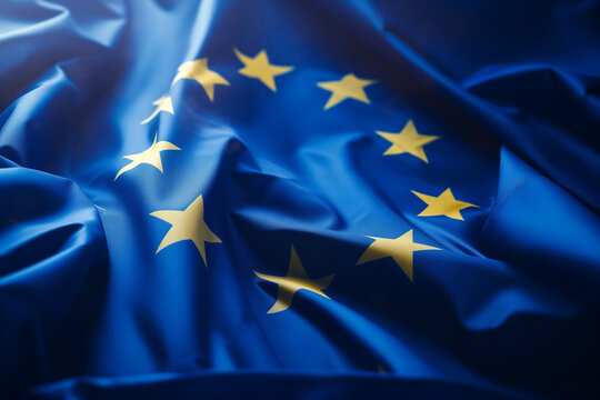 Closeup of the European Union flag fluttering in the wind. fabric texture design. Generative AI