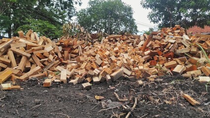 Obraz premium A pile of waste of the wood industry in urban which still can use to be recycled