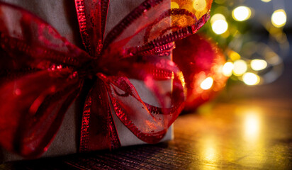 Christmas gift or present box, against magic bokeh background. Beautiful Christmas gift boxes with...