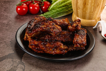 Grilled pork ribs in barbecue sauce