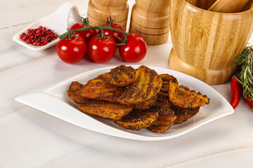 Golden baked potato Idaho with spices