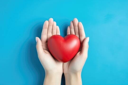 Hands Hold Heart On Blue Background Highquality Photo. Сoncept Heart-Shaped Hands, Blue Background, High-Quality Photo, Symbolic Gesture
